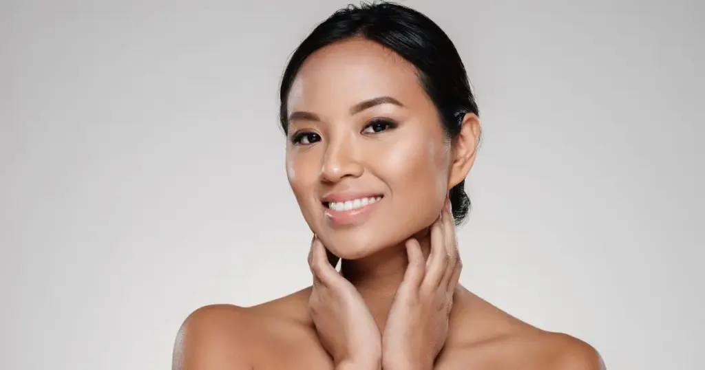 A Radiant Woman Smiling, Highlighting Her Healthy Skin After Diamond Glow Facials In Coeur D'alene, Id